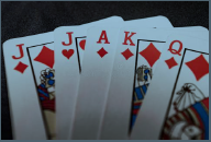 Five playing cards showing perfect Euchre hand in diamonds
